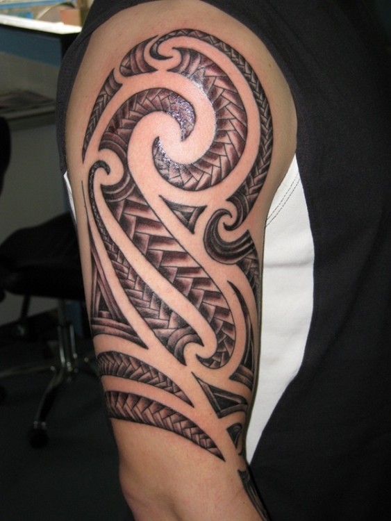 Great Tribal Arm Tattoo Design For Men Made With Blue Ink