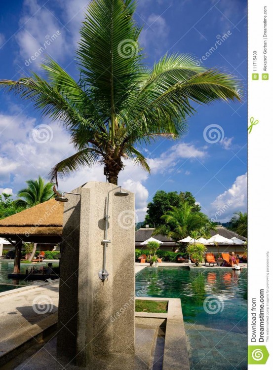 Blue swimming pool outdoor shower on hot sunny day on summer vacation