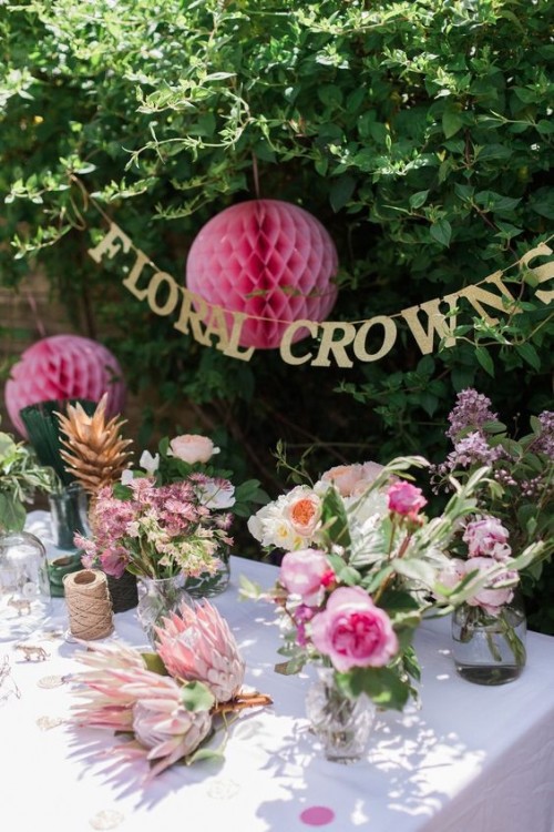 Two of these fun umbrellas spilling over with bright, colorful blooms greeted the guests as they entered the garden