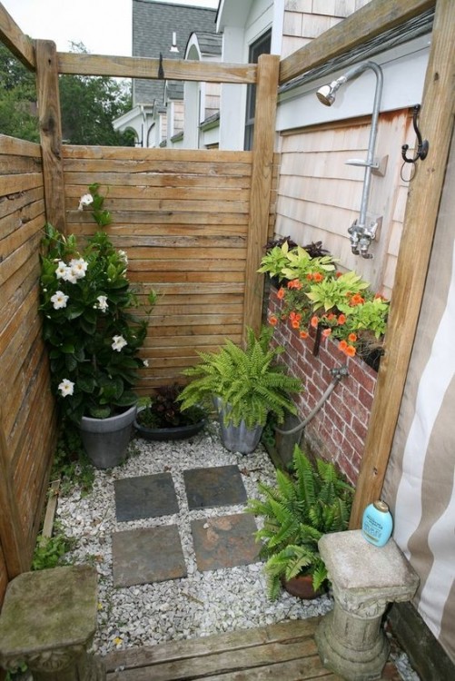 Outdoor showers can include a simple structure with a faucet and a water tank on the top or