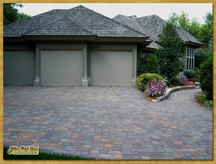 Pavers, custom doors, and stone on upscale home