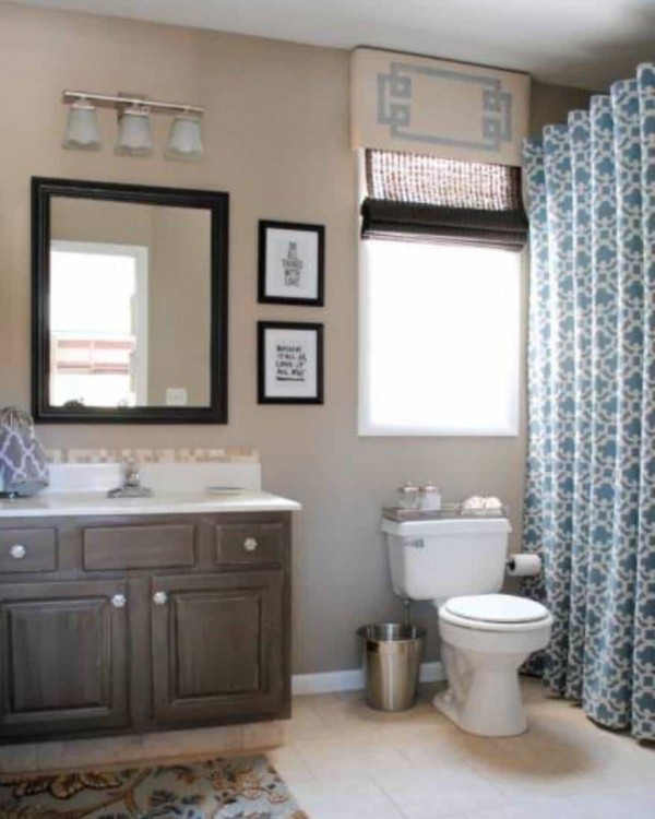Two shower curtains and a valance elevate the boring bathtub nook