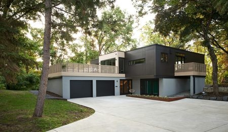 Double doors garage with nicely paved driveway