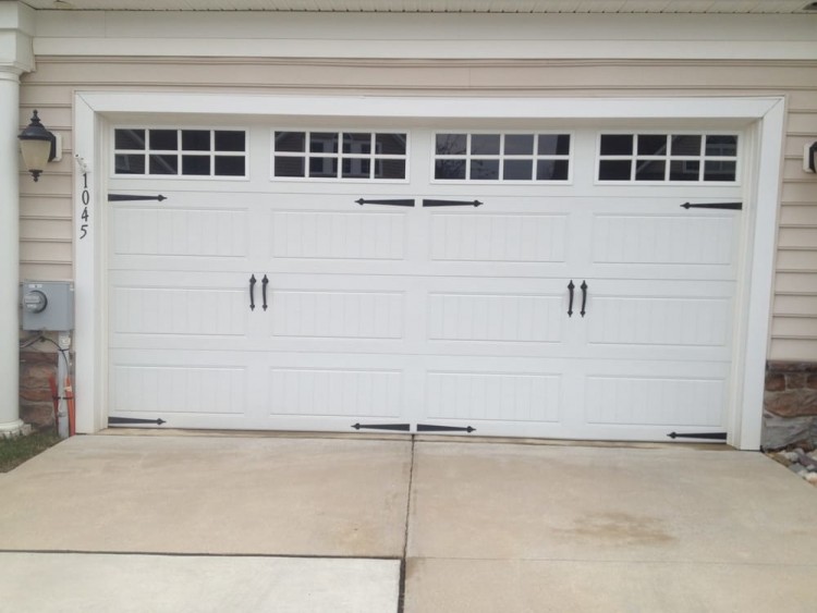 Clopay Coachman Collection carriage house garage door Design 11 with REC13 windows