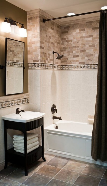 Elegant bathroom with white marble tile and antique mirror accents