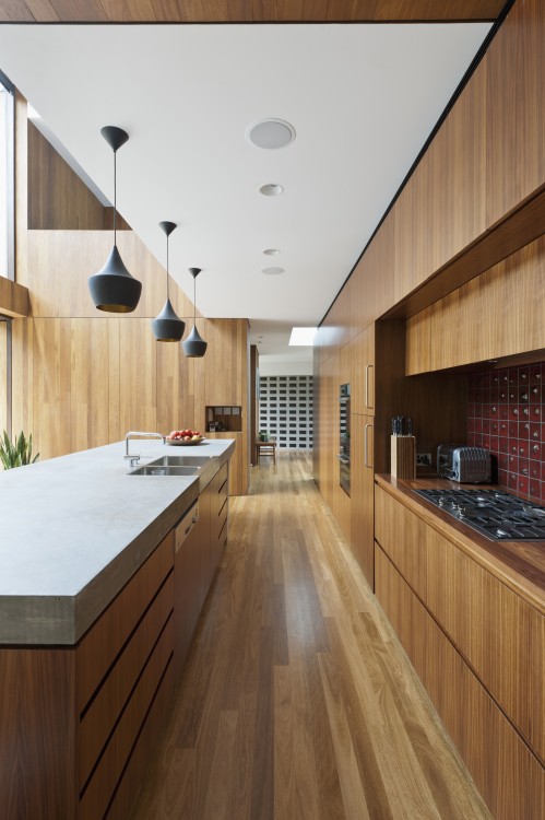 pBuiltin storage and appliances keep the countertops clear in this Manhattan galley kitchen