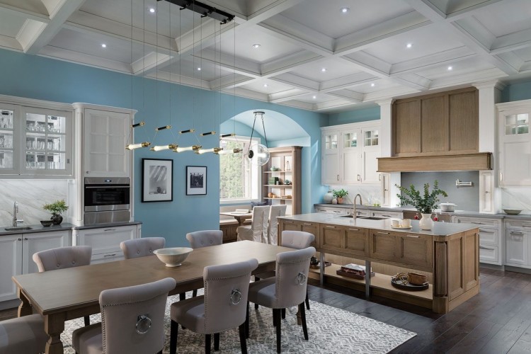 Stunning white and black modern kitchen with medium dark wood flooring.