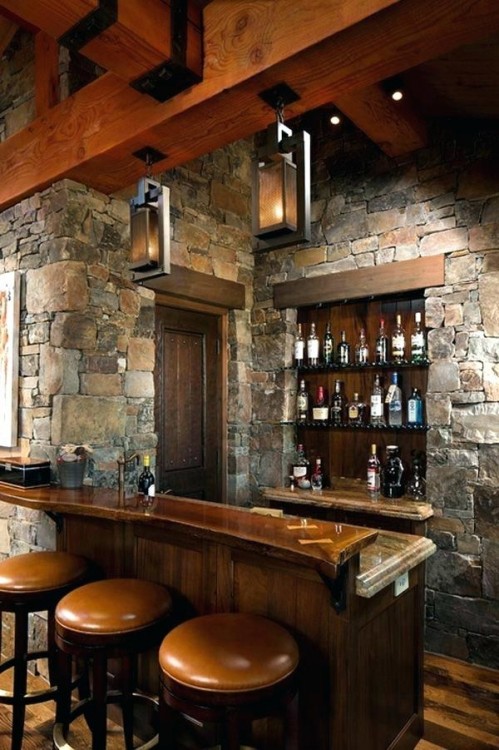 Wonderful use of space in the unique home bar creates the perfect man cave! [