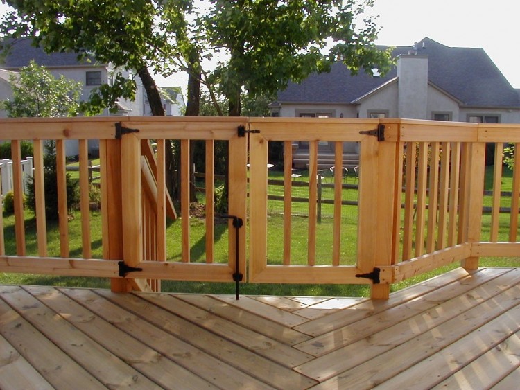 Deck rail design incorporates a bar top with a wide ledge for drinks or food