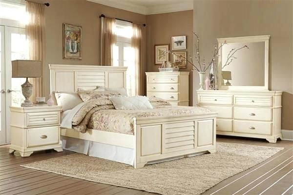 Bedroom with wooden furniture and cream wall