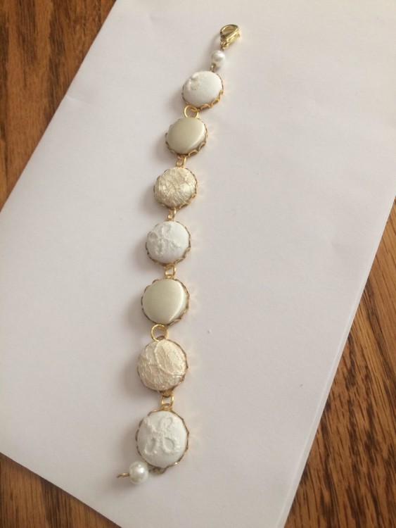 Dettail of a wedding gown with necklace made of pearls