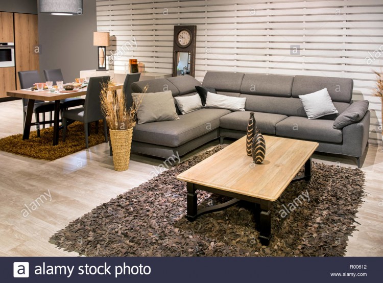 White kitchen cabinets and beige furnishings keep the space