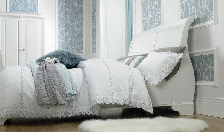 The entire bedroom is white, then this gorgeous pop of navy and white on the bed