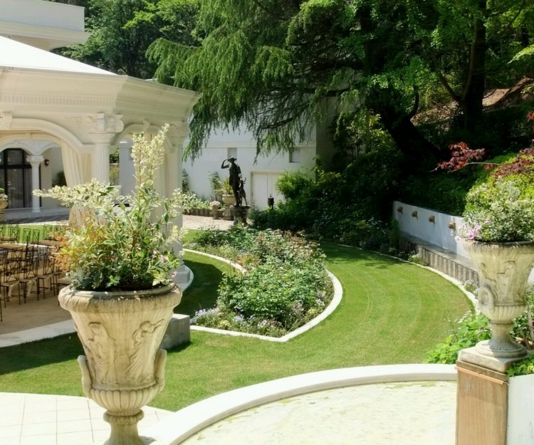 This is an expansive vegetable garden, in a large yard