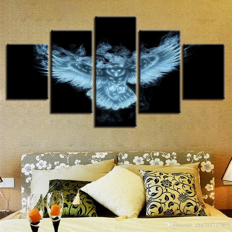 Two abstract paintings with slender black frames are displayed on